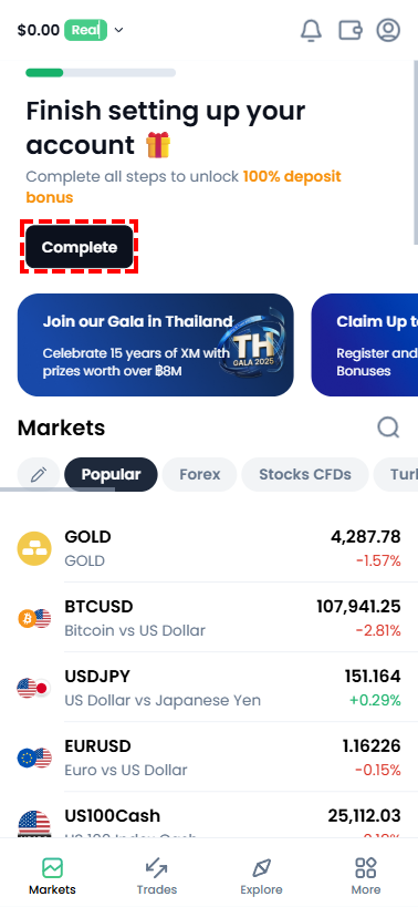 หน้าจอเทรด XM แสดงตำแหน่งปุ่ม Complete สำหรับยืนยันตัวตนมุมบนขวา